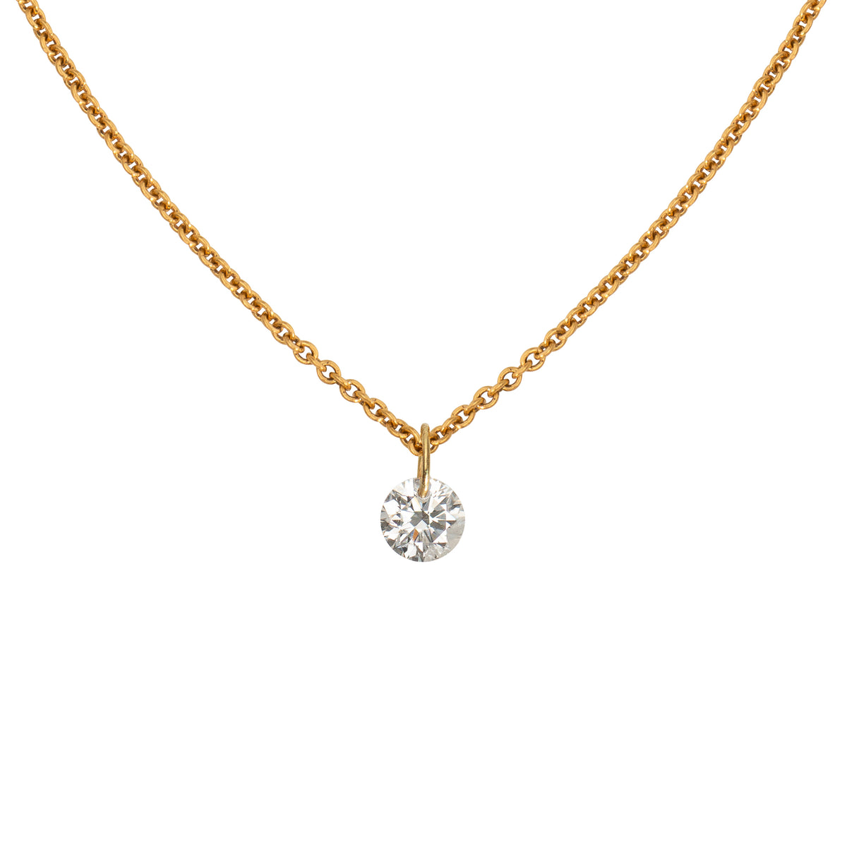 Diamond Solitär Halskette aus 18 Karat Gelbgold mit rahmenlos gefasstem Brillant, Nahaufnahme.